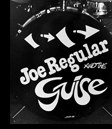 Joe Regular and the Guise drum head